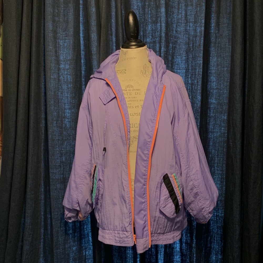 Purple windbreaker.